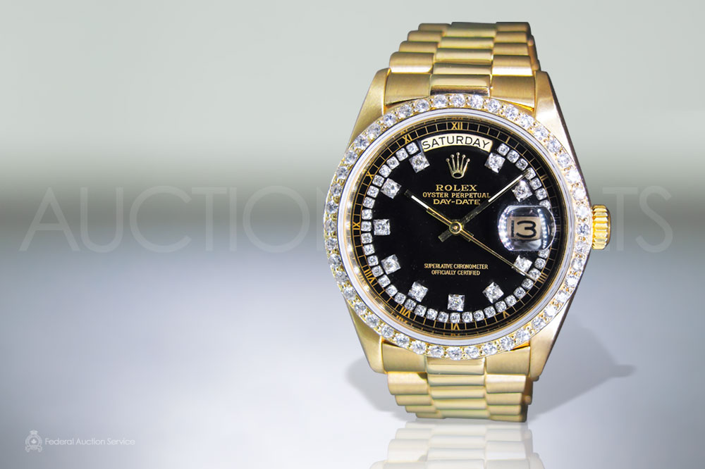 Men's 18k Yellow Gold Rolex Day-Date Automatic Wristwatch sold for $16,000