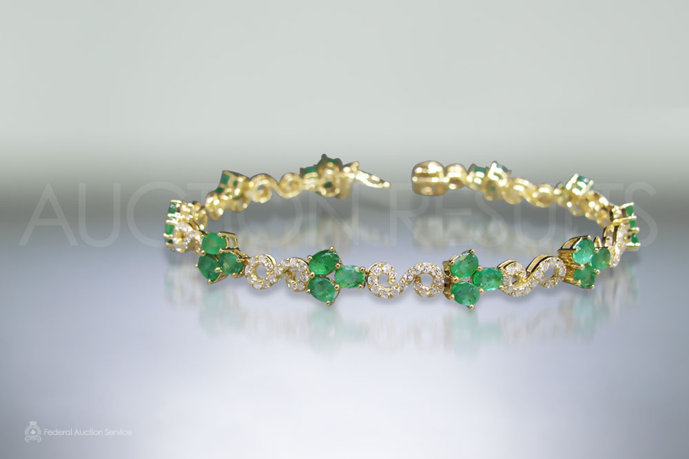 14k Yellow Gold Emerald and Diamond Bracelet sold for $3,000