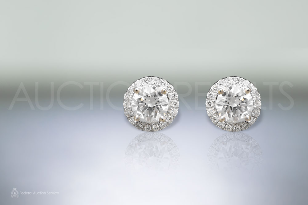 Lady's 18k White Gold 1.40ct (TDW) Diamond Earrings sold for $7,500